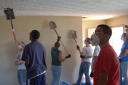 Students tear down a ceiling in Greensburg